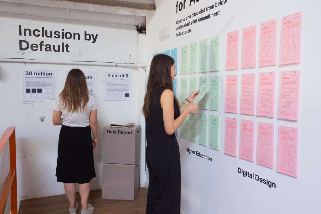 two people exploring exhibition piece Inclusion by Default: Everyday Tools for Accessiblity