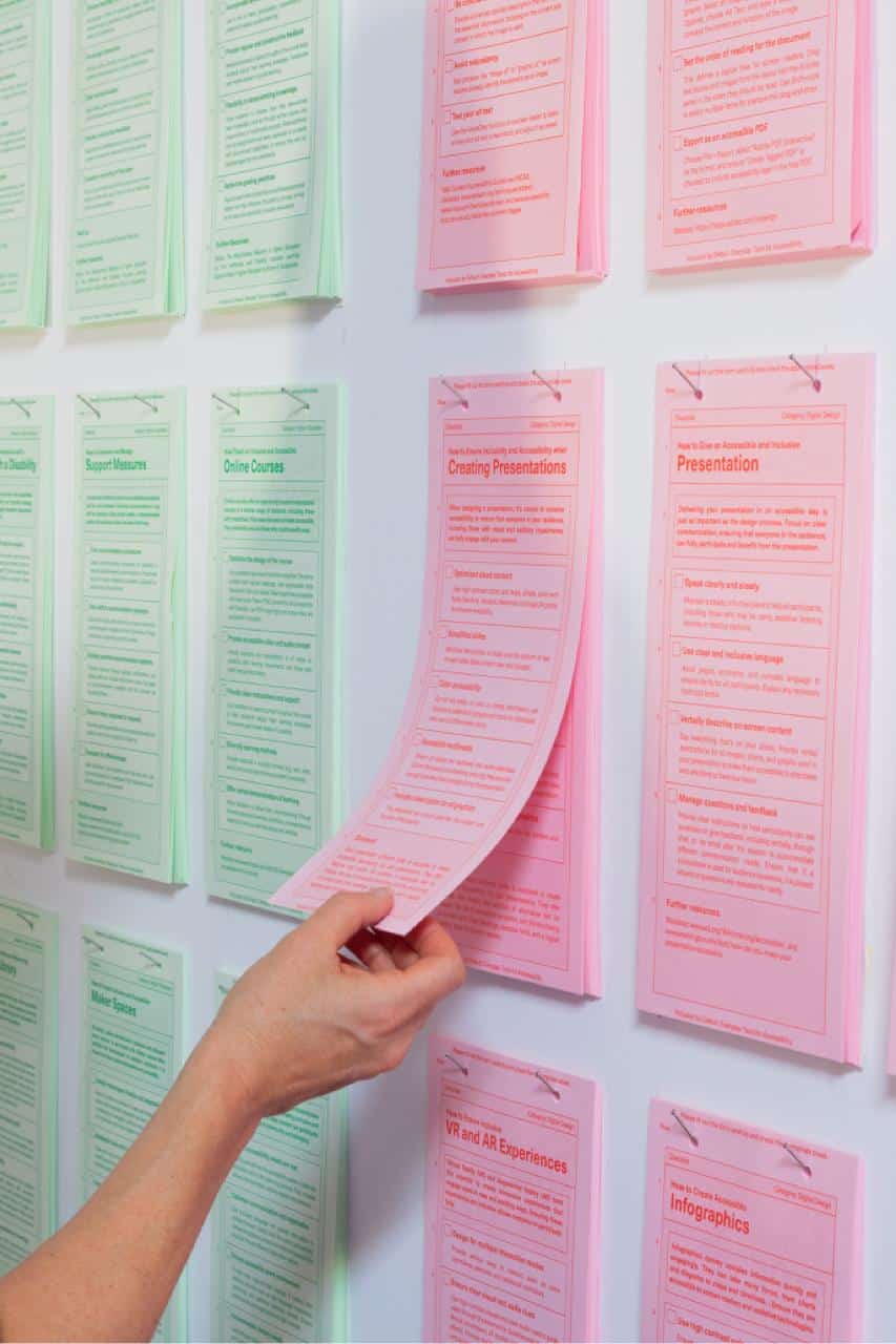 Person taking a checklist of Inclusion by Default: Everyday Tools for Accessiblity